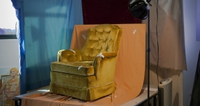 Gold Chair and Blue Curtain